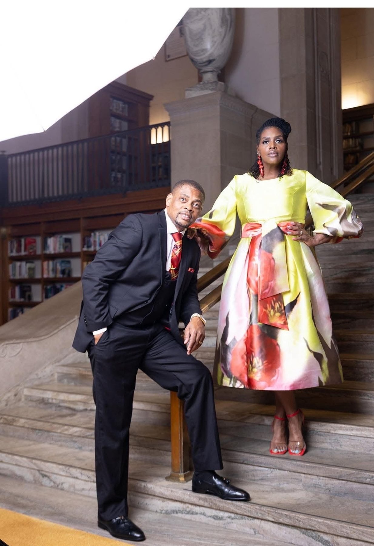 Bishop EW Muir and Pastor Shaurice Muir on a library staircase